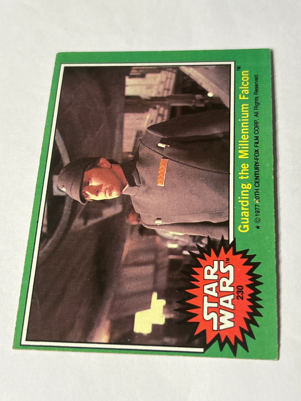 1977 Topps Star Wars Series 4 Green #230 Guarding the Millennium Falcon (Movie Facts Back)