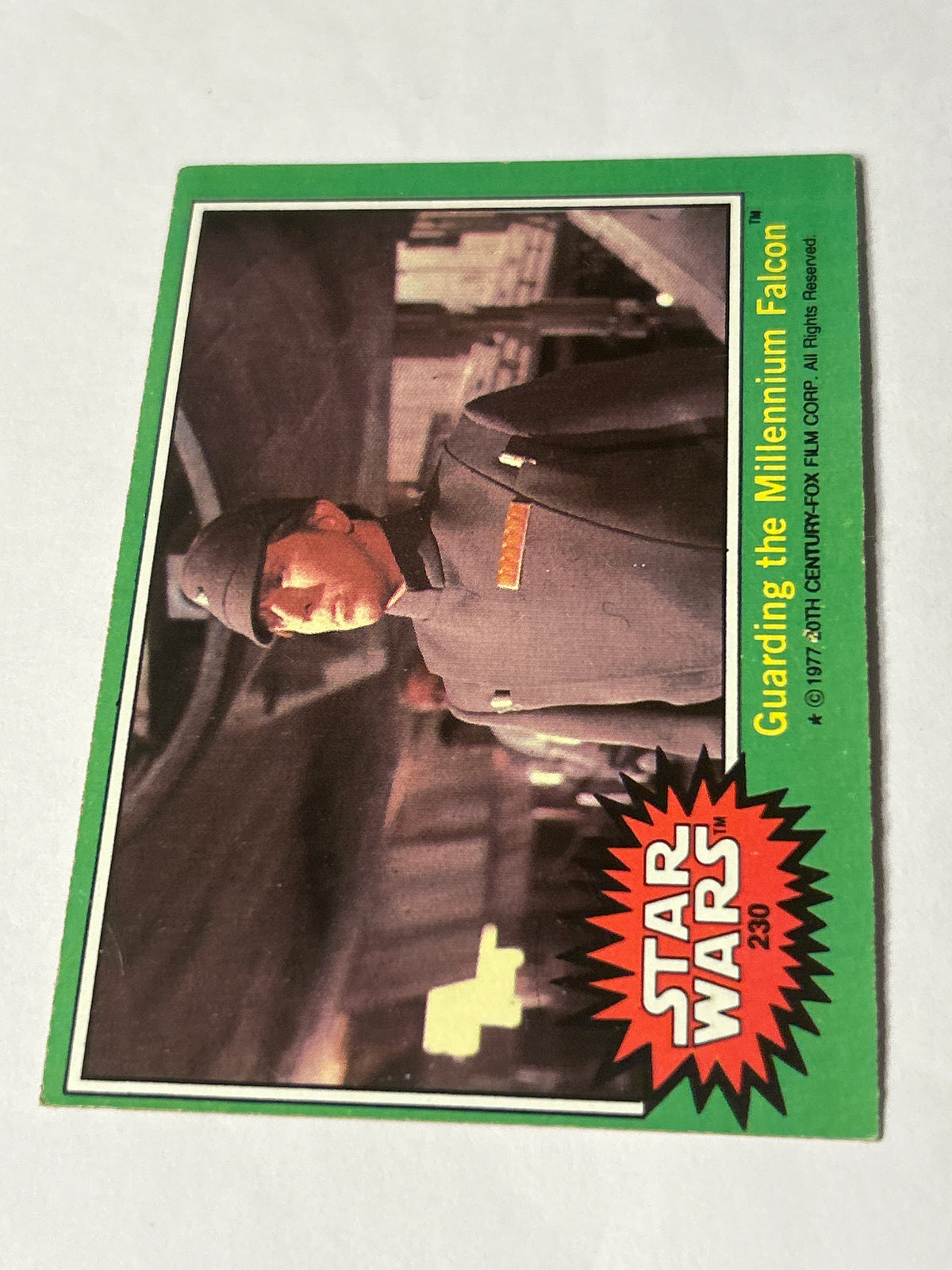 1977 Topps Star Wars Series 4 Green #230 Guarding the Millennium Falcon (Movie Facts Back)