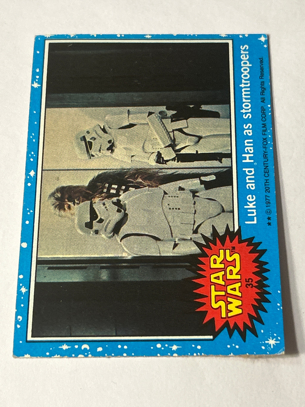1977 Topps Star Wars Series 1 Blue #35 Luke and Han as Stormtroopers (Movie Facts Back)