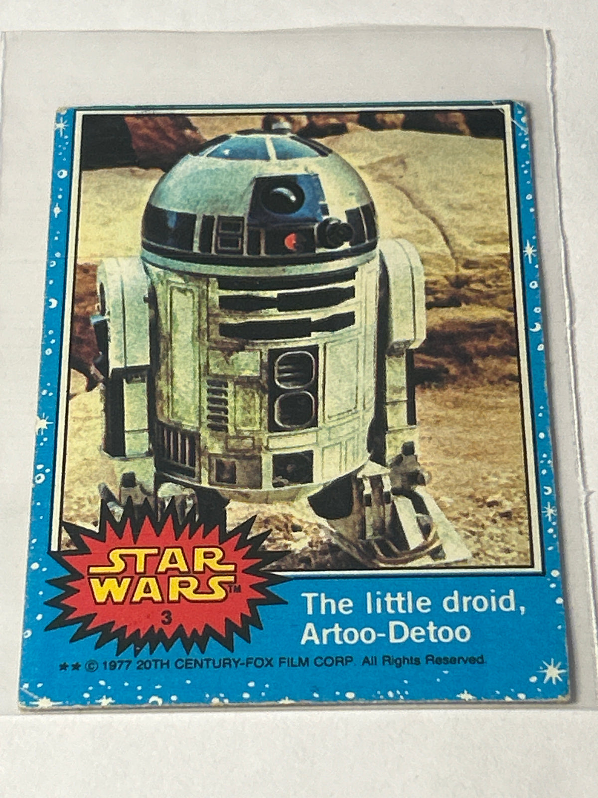 1977 Topps Star Wars #3 The Little Droid, Artoo-Detoo (R2-D2), Blue Series 1, Two-Star Variant, VG