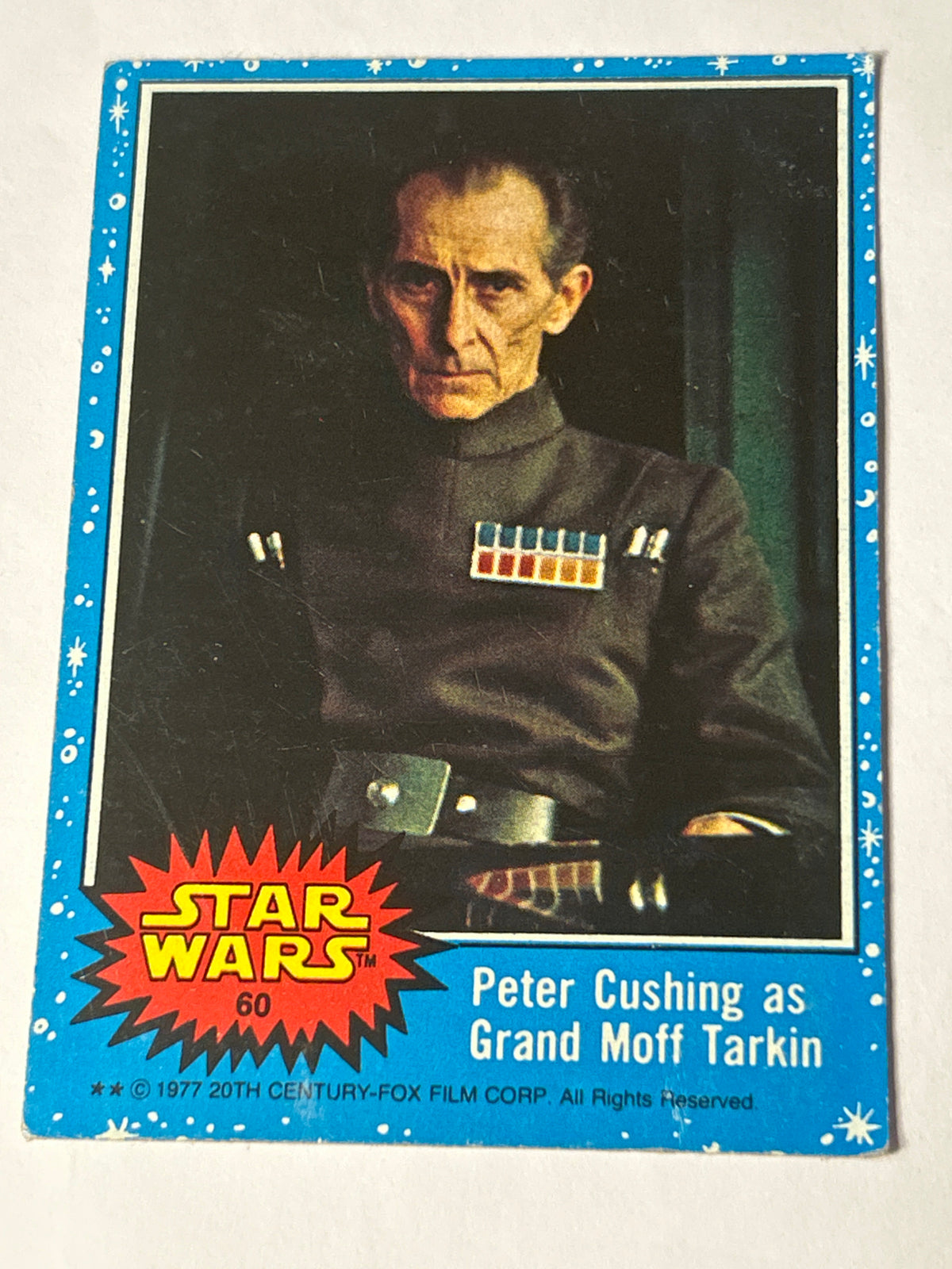 1977 Topps Star Wars Series 1 Blue #60 Peter Cushing as Grand Moff Tarkin (Puzzle Back)