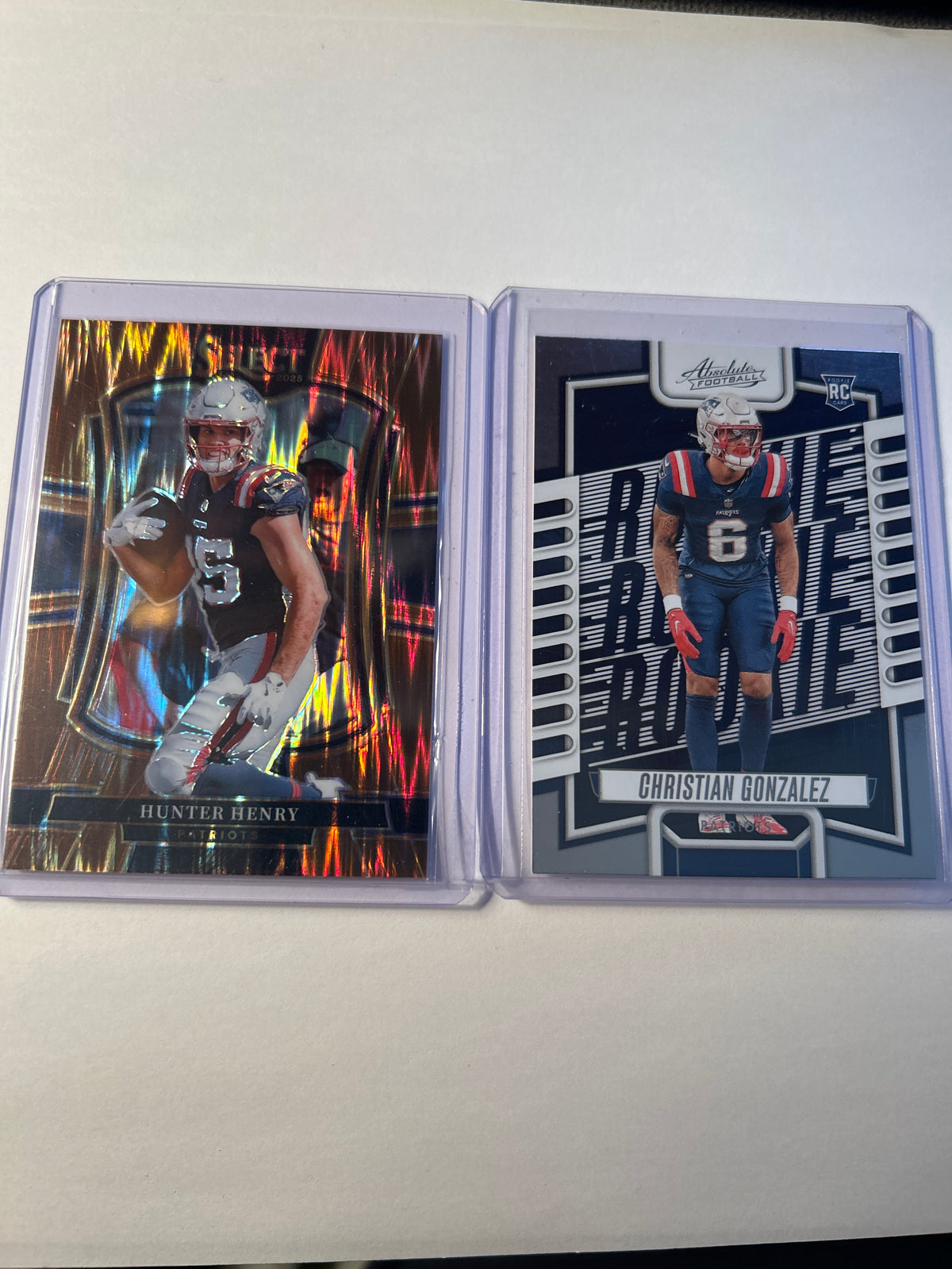 New England Patriots 2 Card Lot Hunter Henry Select Copper Prizm 193/899 Christian Gonzalez Absolute Rookie (RC)